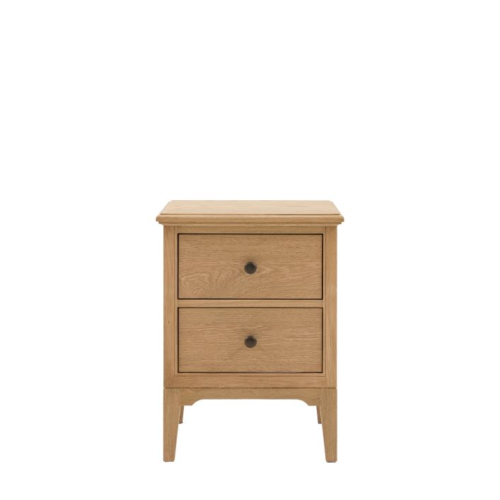 Gallery Direct Malvern Bedside Cabinet is crafted from warm oak woods and veneers, with 2 drawers, metal handles and slim tapered legs