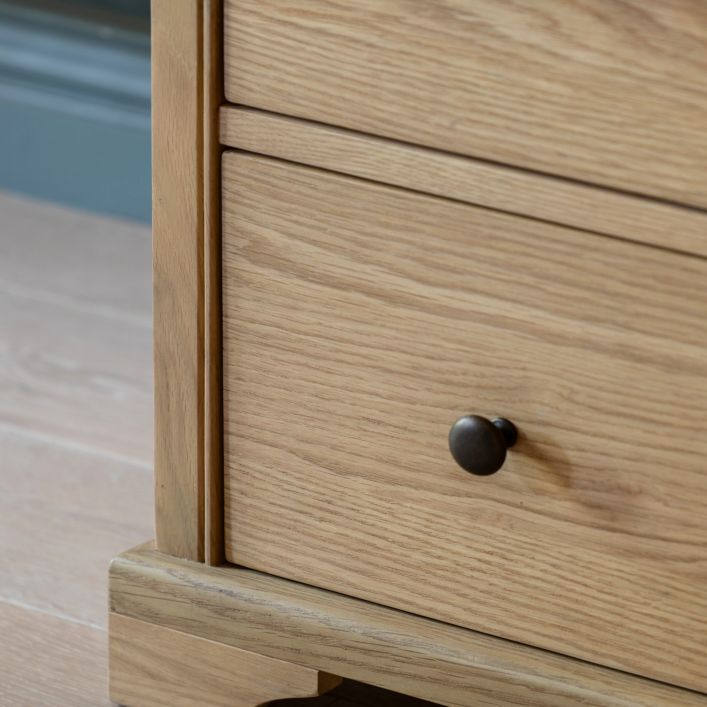 Gallery Direct Malvern 3 Drawer Chest is made using solid oak woods and veneers with contrasting dark metal handles 