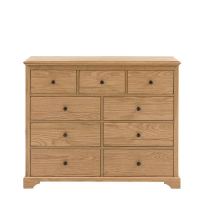 Gallery Direct Malvern 9 Drawer Chest is constructed using premium oak solids and veneers with wood-grain pattern and complemented by dark metal knobs