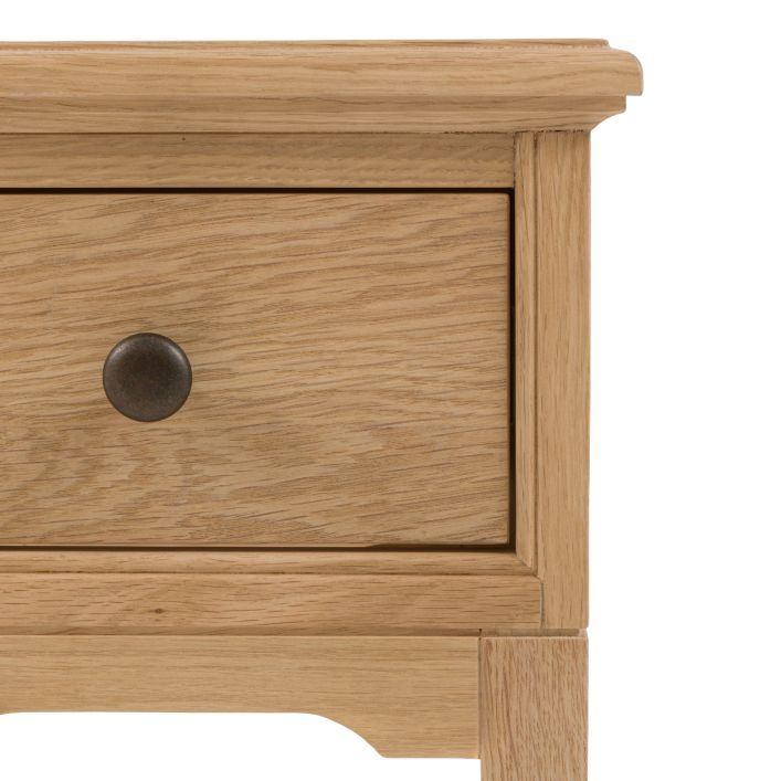 Gallery Direct Malvern Small Bedside Cabinet features 1 drawer with round metal handle in a warm oak wood-grain effect