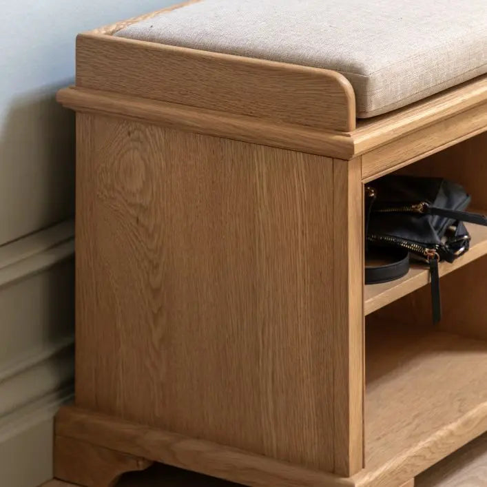 Gallery Direct Malvern Hall Bench has a solid oak wood and veneer frame with 6  storage cubbies, and a padded seat cushion on top
