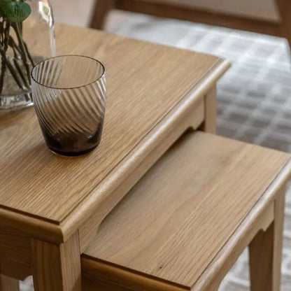 Gallery Direct Malvern Nest of 2 Tables crafted from solid oak wood and veneers with a natural wood grain finish throughout
