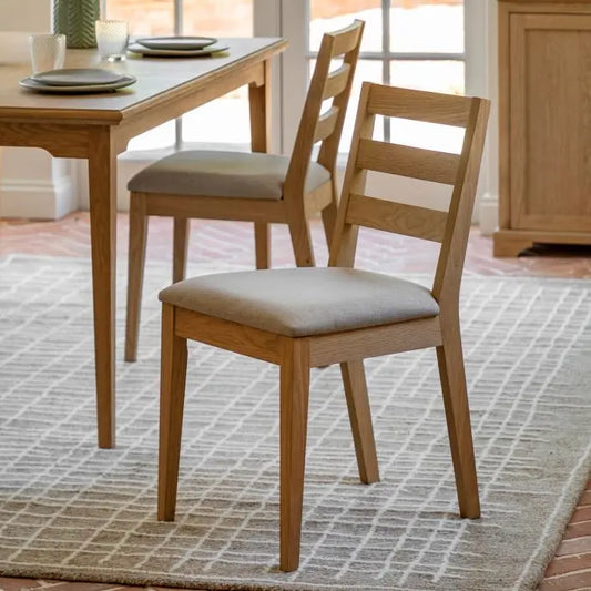 Gallery Direct Malvern Pair of Upholstered Dining Chairs in a natural wood and oak veneer frame with a padded seat cushion  