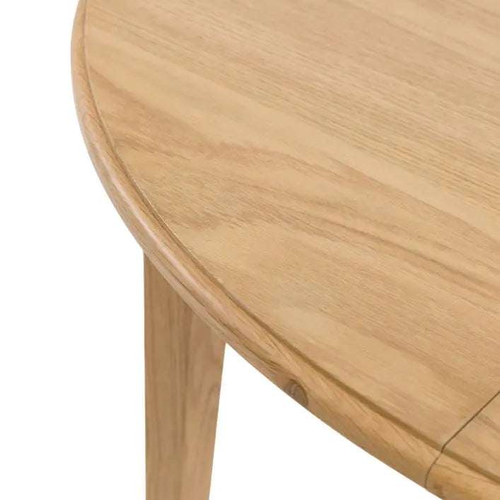 Gallery Direct Malvern Round Extending Dining Table crafted from natural oak wood and veneers with a wood-grain effect and slim tapered legs