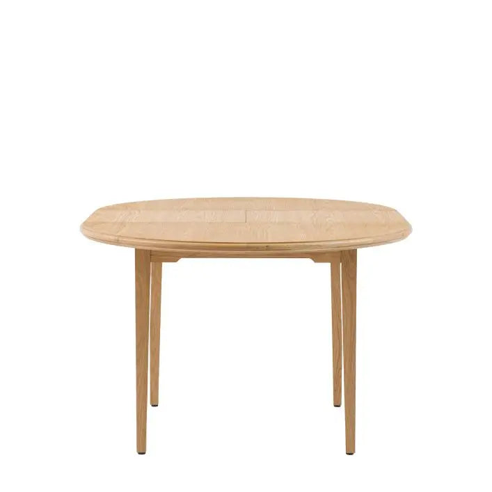Gallery Direct Malvern Round Extending Dining Table crafted from solid oak and veneers with slim tapered legs and a central extension mechanism