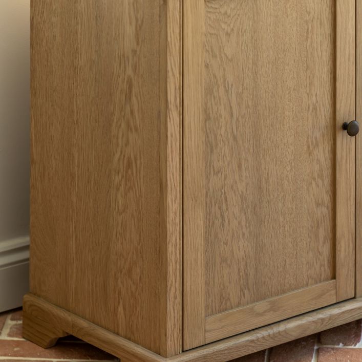 Gallery Direct Malvern Large Sideboard features  cupboard doors and 3 drawers, crafted from solid oak woods and veneers with a wood-grain pattern and metal handles