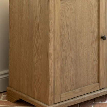Gallery Direct Malvern Large Sideboard features  cupboard doors and 3 drawers, crafted from solid oak woods and veneers with a wood-grain pattern and metal handles