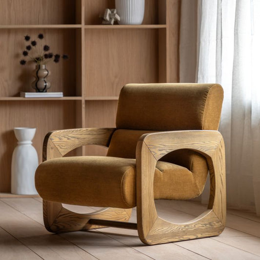 The Gallery Direct Marco Armchair features a wooden retro inspired frame and a generously padded seat upholstered in Verona Golden coloured fabric