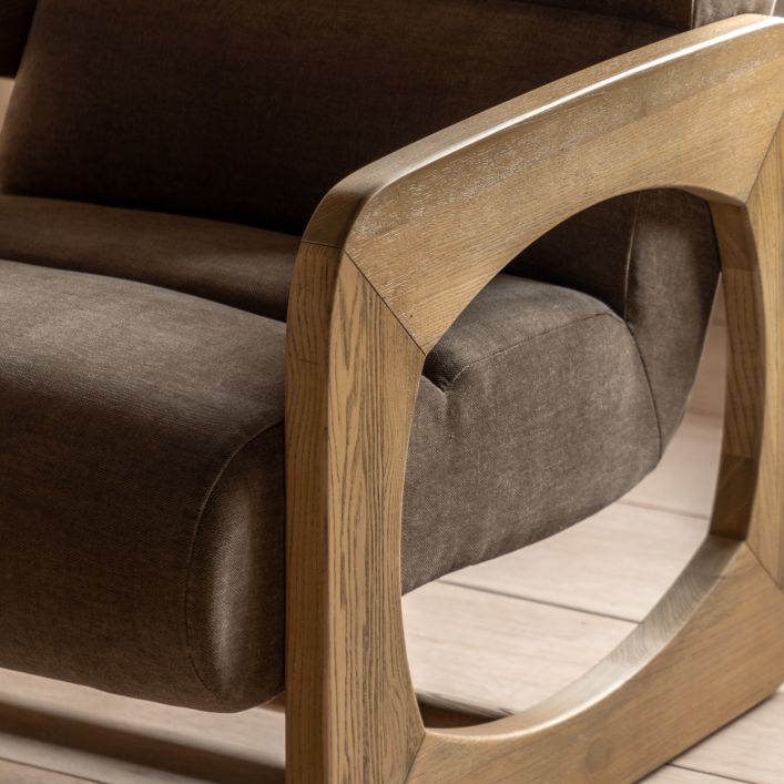 Gallery Direct Marco Armchair features a retro inspired sculptural wooden frame, and a padded seat upholstery in a Verona Sepia coloured fabric