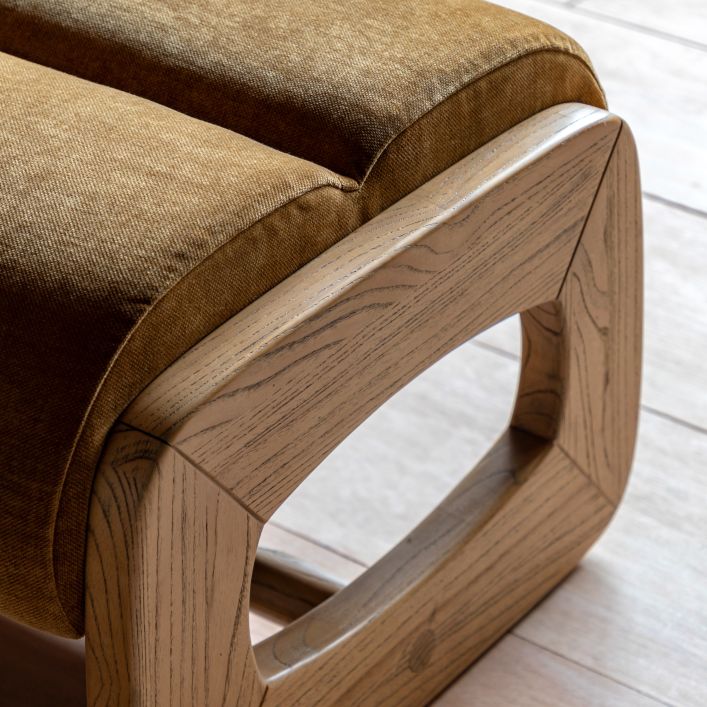 Gallery Direct Marco Footstool features a sculptural wooden frame, and padded upholstery in Verona Golden coloured fabric