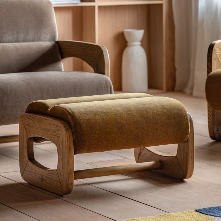 The Gallery Direct Marco Footstool is available in Verona Golden or Verona Sepia colours, both with a modern and sculptural wooden frame
