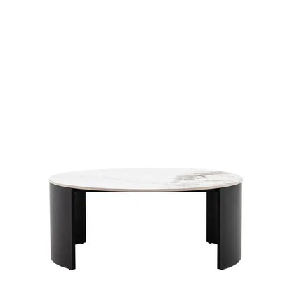 The Gallery Direct Marzio Round Coffee Table features a Carrara marble-style stone table top and gently curved, black metal legs for a contemporary design