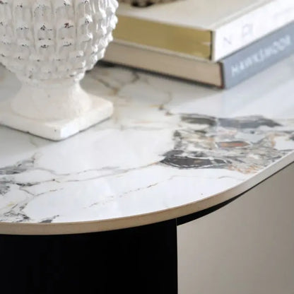 Gallery Direct Marzio Console Table is a striking piece of furniture with a marble table top and sleek black metal legs