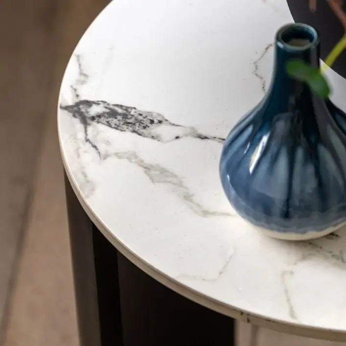 Gallery Direct Marzio Side Table features a round Carrara marble table top with natural individual veining 