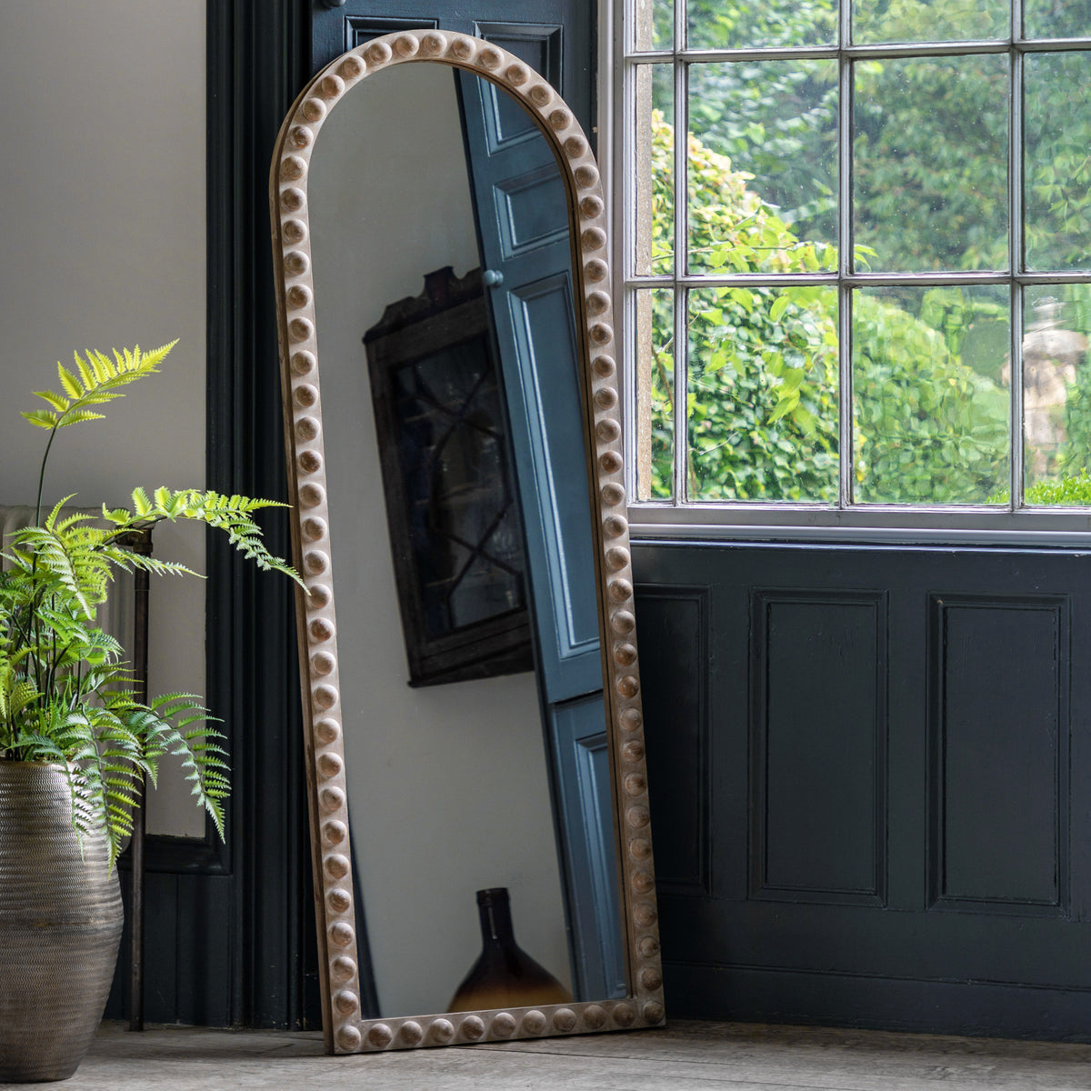Gallery Direct Millbrook Arch Leaner Mirror displayed in a styled interior