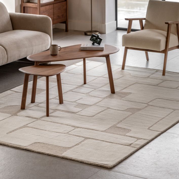 The Montauk Tufted Graphic Rug from Gallery Direct measures 2000x2900mm and is hand tufted from a wool and polyester mix, in a neutral colour palette with an abstract graphic pattern