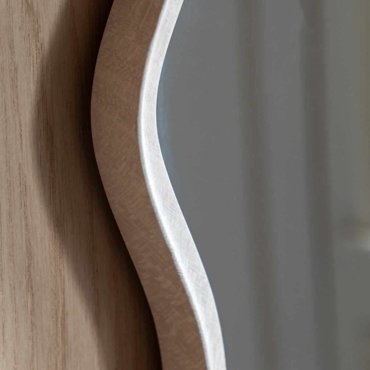 Gallery Direct Monterey Wave Round Mirror Smoke, close-up of the mirror and frame details