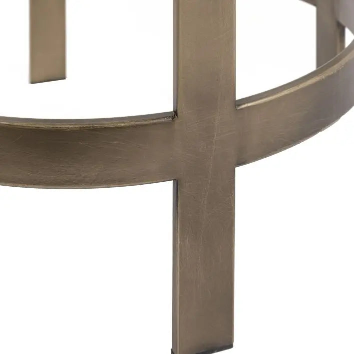 Gallery Direct Monti Round Side Table features a slender bronze metal frame and a toughened glass surface