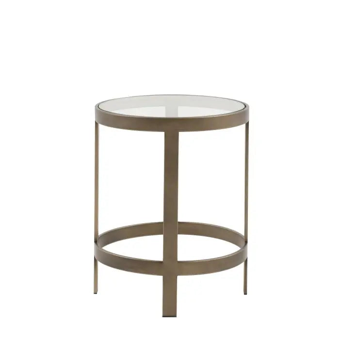 The Gallery Direct Monti Side Table has a round toughened glass table top and bronze metal frame 