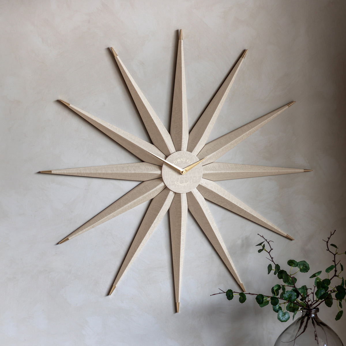 Gallery Direct North Star Wall Clock Light Grey displayed in a styled interior