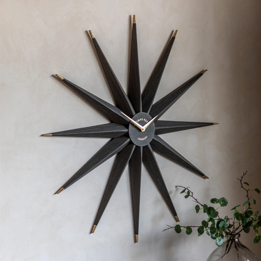 Gallery Direct North Star Wall Clock Warm Grey displayed in a styled interior