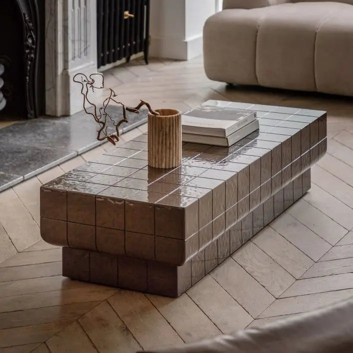 The Gallery Direct Novara Rectangular Coffee Table is an Italian Retro inspired piece crafted from reinforced glass concrete with a faux tile pattern and charcoal brown glaze