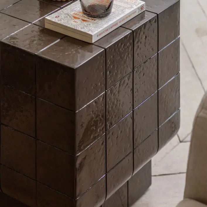 The Gallery Direct Novara Italian inspired Retro Side Table features a faux tile pattern in a charcoal glaze finish