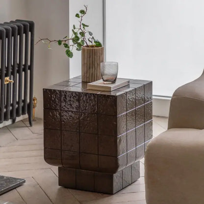 The Gallery Direct Novara Side Table is an Italian Retro Inspired piece in a charcoal brown glaze with faux tile pattern detail, made from GRC