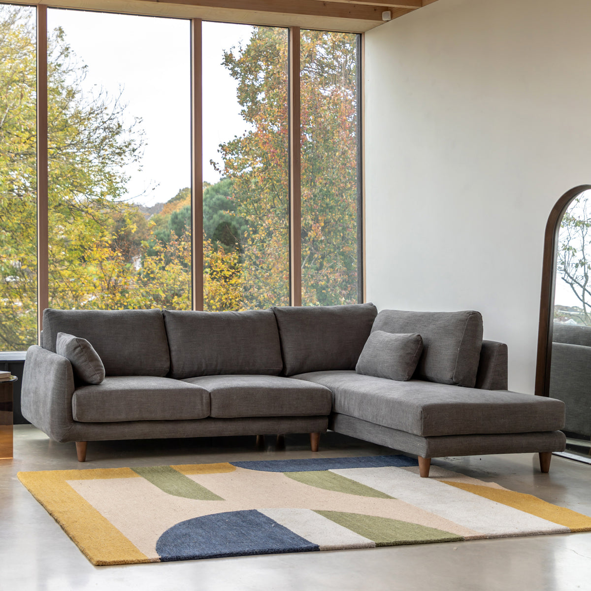 Gallery Direct Oakwood Chaise RH Sofa styled in a living room