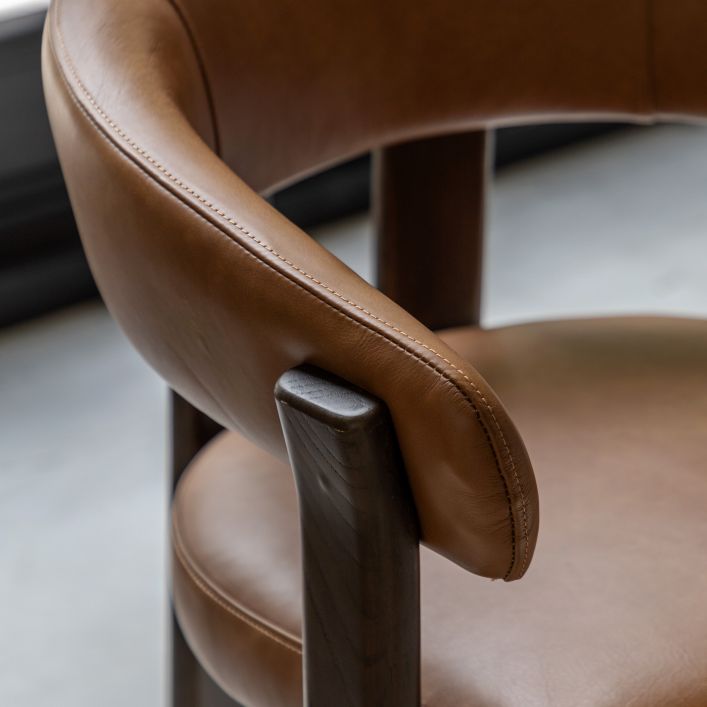 Gallery Direct Onda Dining Chair in Brown Leather, with a curved backrest and charcoal brown solid wood frame
