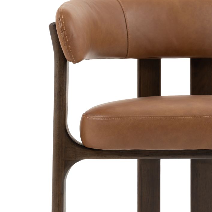 The Gallery Direct Onda Dining Chair is an Italian inspired design with a dark wood frame and Brown Leather seat and backrest cushions