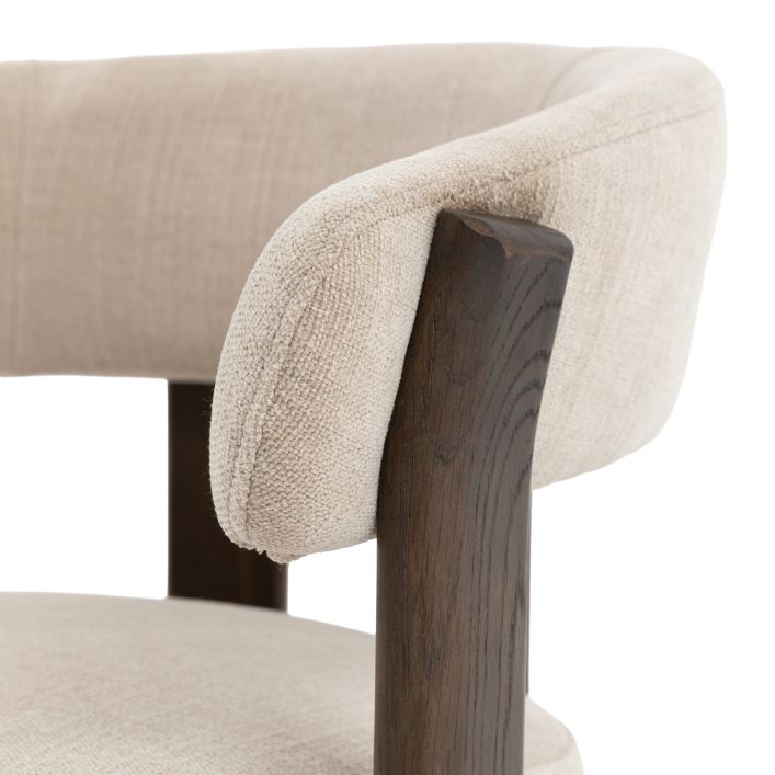 Gallery Direct Onda Dining Chair with a curved backrest upholstered in a Natural coloured linen with contrasting dark wood frame