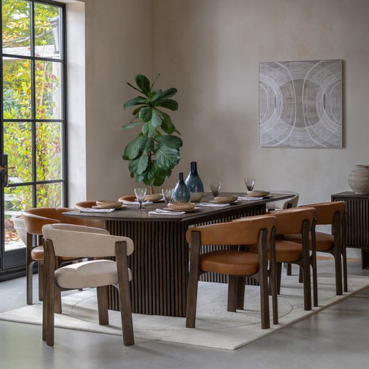 The Gallery Direct Onda Rectangular Extending Dining Table constructed from oak wood and premium veneers in a charcoal brown finish with a distinctive slatted wave design