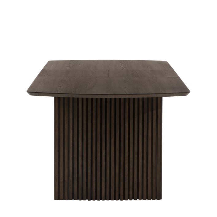 Gallery Direct Onda Rectangular Extending Dining Table featuring a slatted wave design on the legs and a sleek wooden table top with extension leaves
