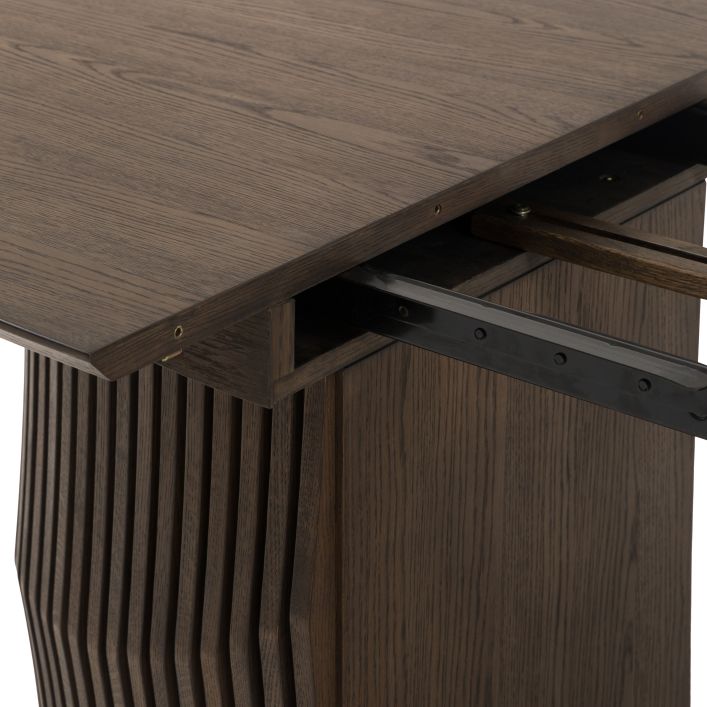Gallery Direct Onda Oval Dining Table in a charcoal brown oak and veneer wood finish with a seamless extending mechanism that can seat up to 6 people