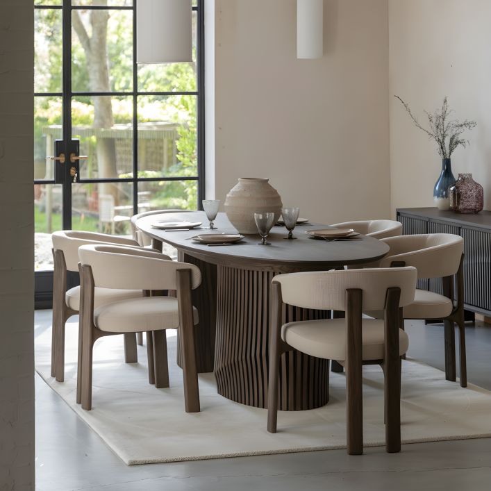The Gallery Direct Onda Dining Table is an Italian inspired Oval table that extends to seat up to 6 people, with a striking slatted wave base constructed from oak wood and veneers in a charcoal brown finish