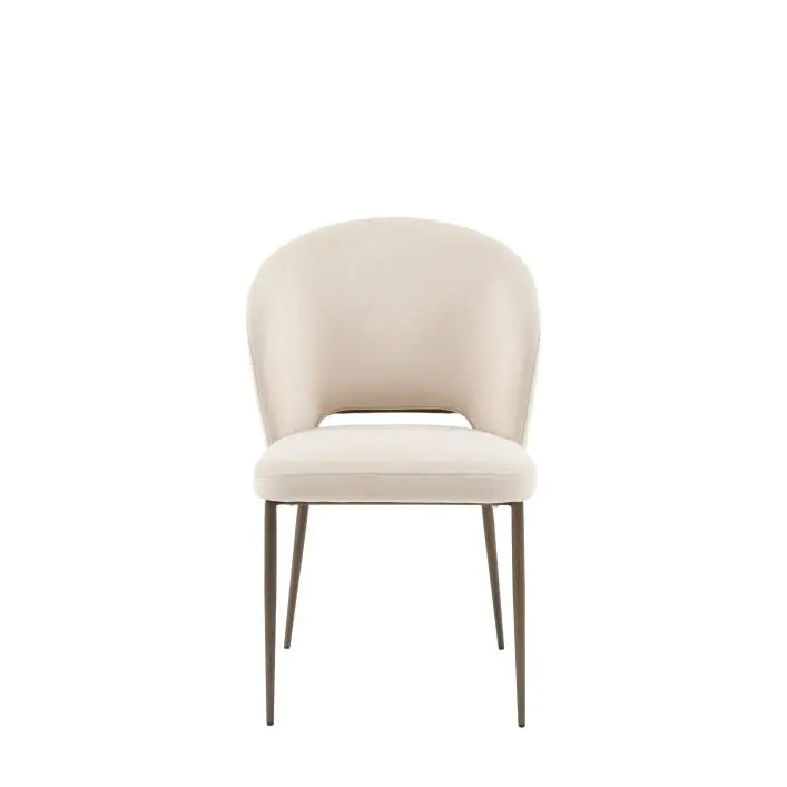 Gallery Direct Pair of Cosenza Dining Chairs feature a fully upholstered seat in a soft Vanilla colour, with bronzed metal legs