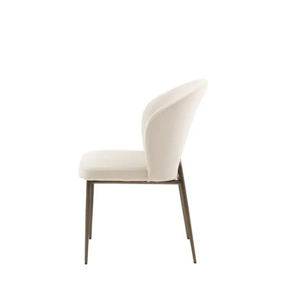 Gallery Direct Pair of Cosenza Dining Chairs fully upholstered in a soft Vanilla coloured fabric, with bronzed metal legs