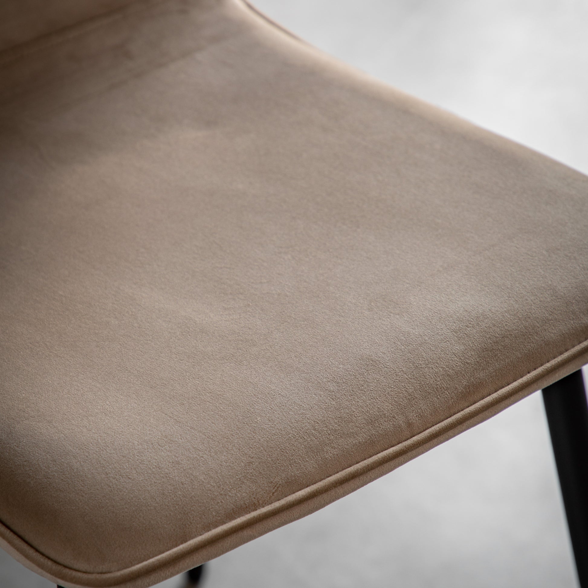 Gallery Direct Pair of Widdicombe Dining Chairs upholstered in a soft Taupe coloured velvet style fabric with refined line stitching