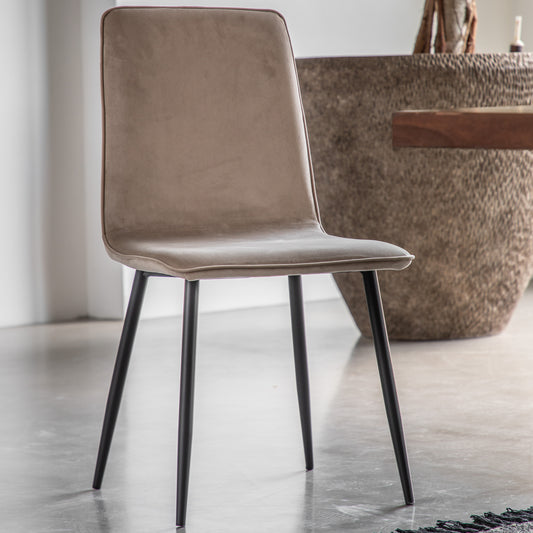 Gallery Direct Pair of Widdicombe Dining Chairs are fully upholstered in a soft neutral Taupe coloured fabric with contrasting black metal legs 