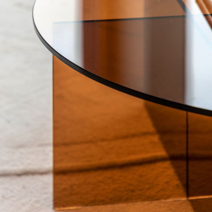 Gallery Direct Parioli Coffee Table features a round toughened glass table top with cross legged base in Bronze