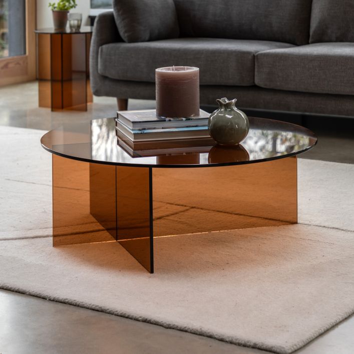 The Gallery Direct Parioli Round Glass Coffee Table is a modern 70s inspired piece made from toughened bronze tinted glass