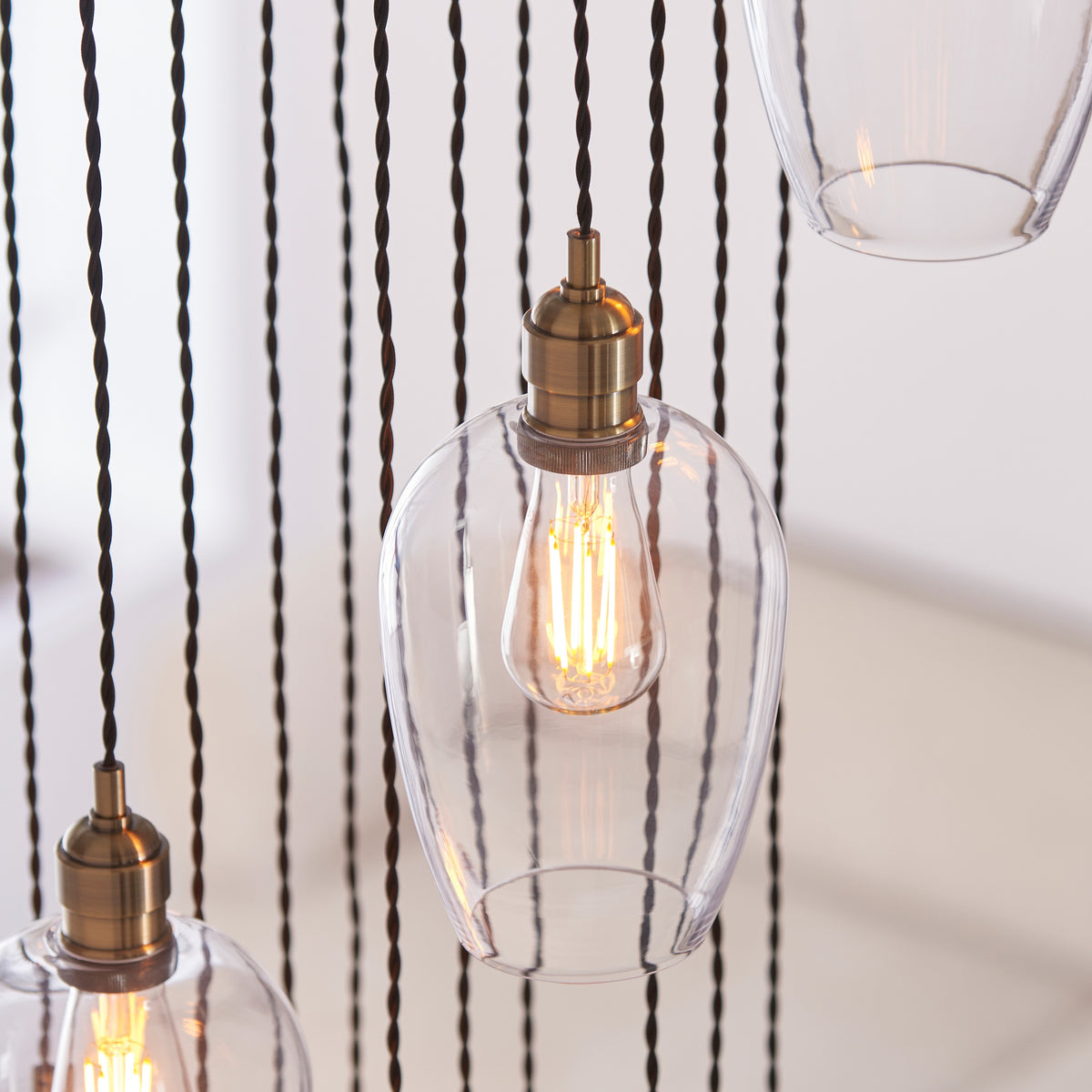 Gallery Direct Polaris 13 Pendant Light Antique Brass, close-up of the finish and design