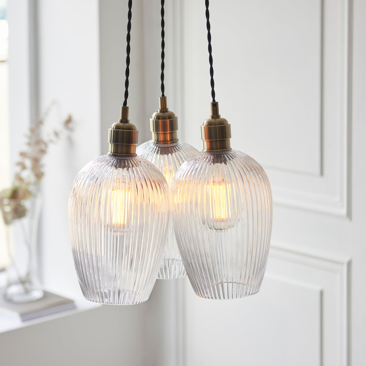 Gallery Direct Polaris 3 Ribbed Cluster Pend Light Antique Brass, close-up of the finish and design