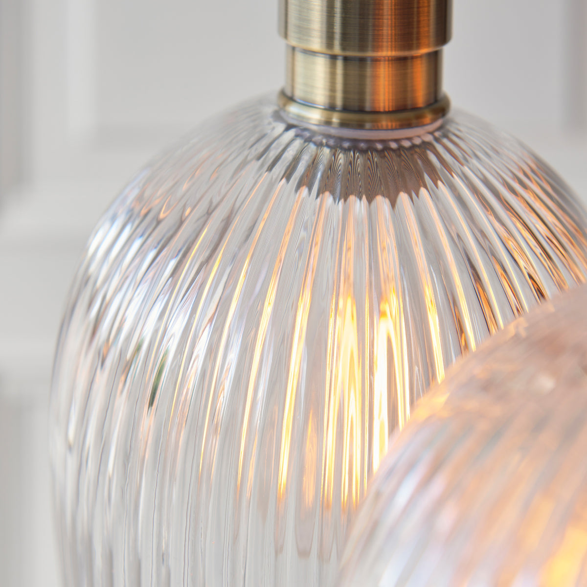 Gallery Direct Polaris 3 Ribbed Cluster Pend Light Antique Brass, close-up of the finish and design