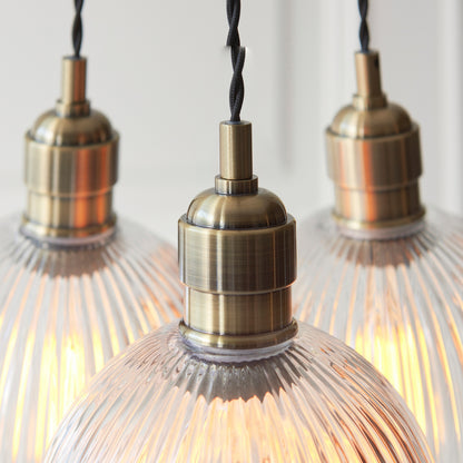Gallery Direct Polaris 3 Ribbed Cluster Pend Light Antique Brass, close-up of the finish and design