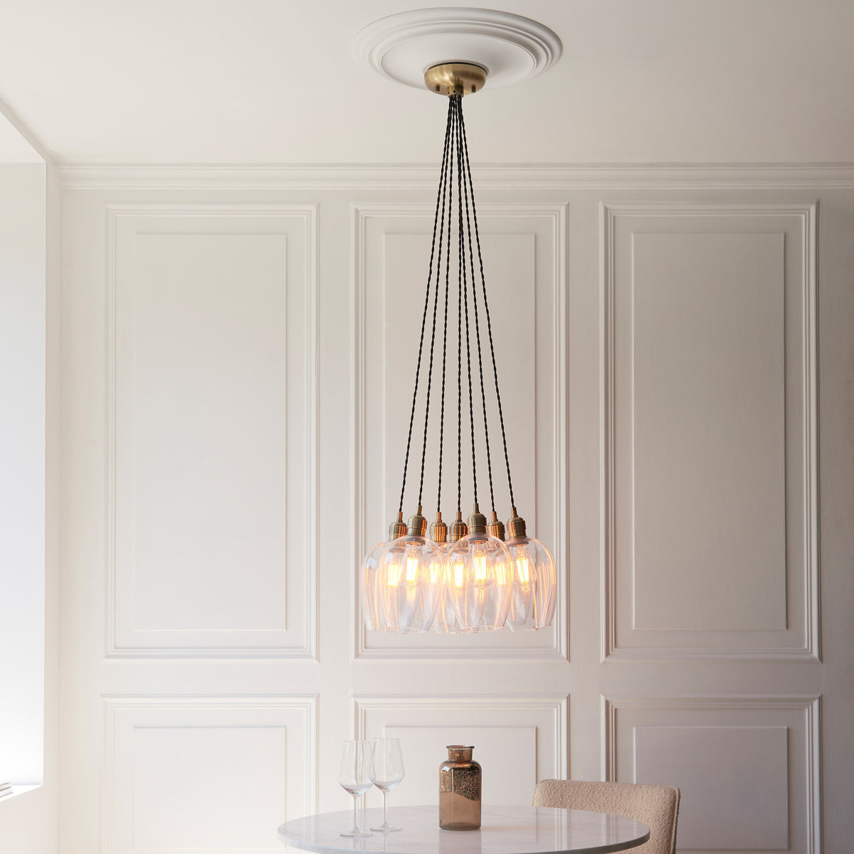 Gallery Direct Polaris 7 Cluster Pendant Light Antique Brass, styled in a room setting