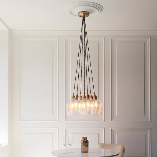 Gallery Direct Polaris 7 Cluster Pendant Light Antique Brass, styled in a room setting
