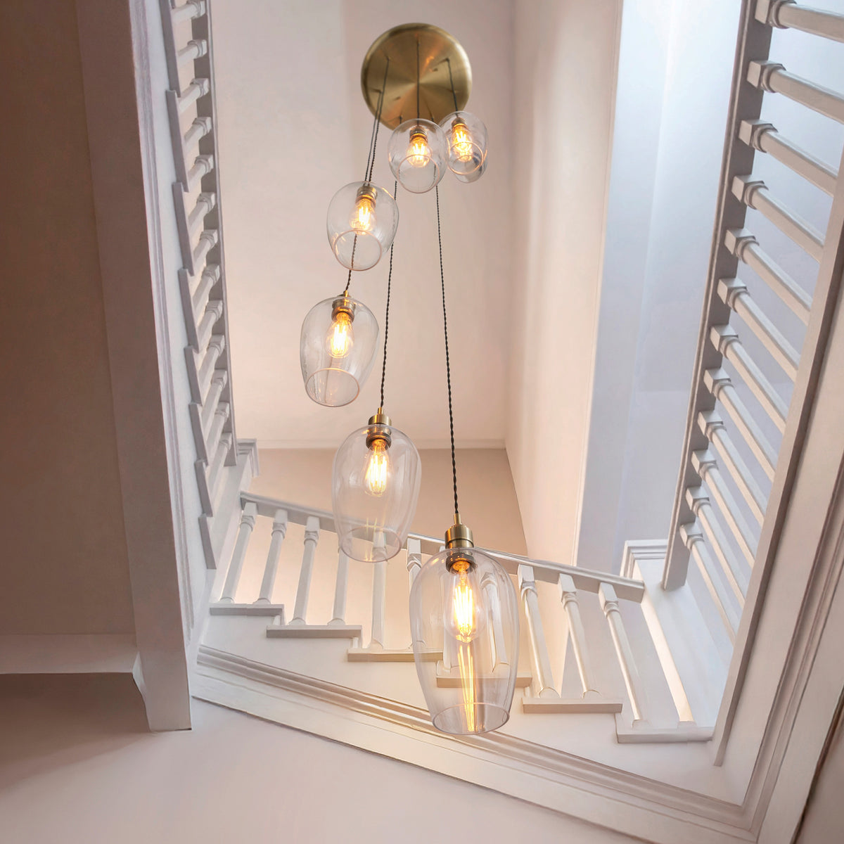 Gallery Direct Polaris 7 Pendant Light Antique Brass, styled in a room setting