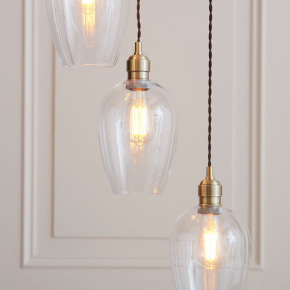 Gallery Direct Polaris 7 Pendant Light Antique Brass, styled in a room setting